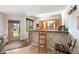 Charming bar area with unique tilework, wooden accents, and a cozy atmosphere for enjoying drinks and conversation at 12291 S Critchell Ln, Littleton, CO 80127