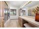 Bright bathroom with a large vanity, walk-in shower, and serene outdoor views creating a spa-like experience at 12291 S Critchell Ln, Littleton, CO 80127