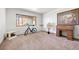 Inviting room with a classic roll-top desk, a bright window, and comfortable carpet perfect for an office at 12291 S Critchell Ln, Littleton, CO 80127