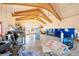 Spacious garage interior showcasing high ceilings, exposed wood beams, and ample storage space, offering functionality at 12291 S Critchell Ln, Littleton, CO 80127