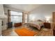 Main bedroom with hardwood floors and view to the outside at 12291 S Critchell Ln, Littleton, CO 80127