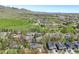 Wide aerial view showcases established neighborhood, community park, and foothills in the distance at 805 Union Ave, Boulder, CO 80304