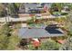 Aerial view showcasing a home's expansive yard with a patio, lush greenery, and solar panels at 805 Union Ave, Boulder, CO 80304