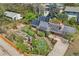 Stunning aerial view of the home with solar panels, a lush backyard, and raised garden beds at 805 Union Ave, Boulder, CO 80304