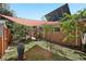 Backyard of the home features a brick exterior and a patio covered with a red awning at 805 Union Ave, Boulder, CO 80304