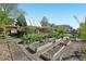 Charming backyard featuring raised garden beds and a relaxing pergola covered patio at 805 Union Ave, Boulder, CO 80304