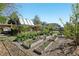 The backyard offers raised garden beds and a patio in a serene setting at 805 Union Ave, Boulder, CO 80304