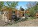Home exterior with lush backyard and outdoor seating area on brick patio at 805 Union Ave, Boulder, CO 80304