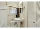 Classic bathroom with pedestal sink, white tile, and traditional fixtures at 805 Union Ave, Boulder, CO 80304