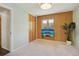 Bedroom with wood paneling, closet, and a mounted television displaying an island scene at 805 Union Ave, Boulder, CO 80304