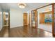 Bedroom with wood floors, bright lighting, and a view into an adjacent room at 805 Union Ave, Boulder, CO 80304