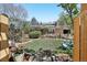 Charming brick home with solar panels, lush lawn, and inviting front yard seating at 805 Union Ave, Boulder, CO 80304