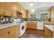 Contemporary kitchen boasts stylish cabinets, white countertops, colorful tile backsplash, and modern appliances at 805 Union Ave, Boulder, CO 80304