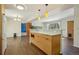 Bright kitchen with custom cabinetry, modern island with breakfast bar, and open layout to the living area at 805 Union Ave, Boulder, CO 80304