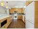 Modern kitchen with custom cabinets, white countertops, a colorful tile backsplash, and stainless steel appliances at 805 Union Ave, Boulder, CO 80304