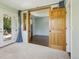 Living room featuring light green walls, carpeted floors, and outdoor views at 805 Union Ave, Boulder, CO 80304