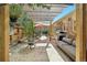 Outdoor brick patio with lounge seating, shade covering, and dining tables at 805 Union Ave, Boulder, CO 80304
