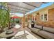 View of a backyard patio space offering multiple seating areas and a grill at 805 Union Ave, Boulder, CO 80304