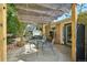 Outdoor patio with shade cover, table, chairs and outdoor lighting at 805 Union Ave, Boulder, CO 80304