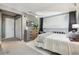 Comfortable bedroom features a loft, soft carpet, a dresser, and a closet, creating an inviting and functional living space at 2491 S Xanadu Way # A, Aurora, CO 80014