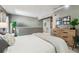 Inviting bedroom with plush carpet, a dresser, and a modern design for a cozy and stylish living space at 2491 S Xanadu Way # A, Aurora, CO 80014