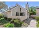 The home's exterior features neutral siding and a cozy patio area with well-kept landscaping at 2491 S Xanadu Way # A, Aurora, CO 80014