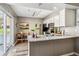 Bright kitchen featuring stainless steel appliances, granite countertops and sliding glass doors at 2491 S Xanadu Way # A, Aurora, CO 80014