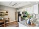 Bright kitchen with stainless steel appliances, white cabinets, and granite countertops at 2491 S Xanadu Way # A, Aurora, CO 80014