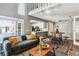 Living room area with stylish furnishings, a cozy couch, and an open layout to the kitchen at 2491 S Xanadu Way # A, Aurora, CO 80014