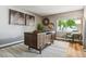 Bright home office featuring a modern desk, and a large window with outdoor views at 2491 S Xanadu Way # A, Aurora, CO 80014