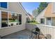 Outdoor patio with a seating area, highlighting the home's connection to nature and providing an inviting space for relaxation at 2491 S Xanadu Way # A, Aurora, CO 80014
