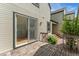 Back deck with sliding glass door to the interior; exterior features siding and wood stairs to the yard at 6414 S Hudson St, Centennial, CO 80121
