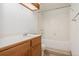 Bathroom featuring tile countertop and backsplash, and bathtub/shower combination at 6414 S Hudson St, Centennial, CO 80121