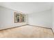 Bright, carpeted bedroom with large windows, providing plenty of natural light at 6414 S Hudson St, Centennial, CO 80121