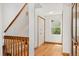 Bright entryway features hardwood floors, a staircase, and a window with a view of the outdoors at 6414 S Hudson St, Centennial, CO 80121