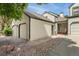Exterior view showing the home's siding, driveway, attached garage, and walkway at 6414 S Hudson St, Centennial, CO 80121