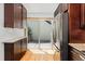 Updated kitchen with stainless steel refrigerator and access to outdoor deck at 6414 S Hudson St, Centennial, CO 80121