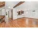 Hardwood floors flow through the living room to the kitchen, enhanced by natural light at 6414 S Hudson St, Centennial, CO 80121