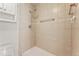 Tiled shower with mounted head and grab bar at 6414 S Hudson St, Centennial, CO 80121