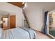 Vaulted bedroom featuring stylish floating stairs, and large window with a scenic view at 19890 Indian Summer Ln, Monument, CO 80132