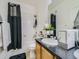 Bathroom includes a shower/tub combo, wood cabinets, and a single sink at 14700 E 104Th Ave # 2605, Commerce City, CO 80022