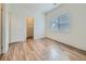 Bright bedroom with hardwood floors, closet and large window at 14700 E 104Th Ave # 2605, Commerce City, CO 80022