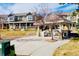 Community outdoor space featuring a gazebo, manicured lawn, and charming walkways at 14700 E 104Th Ave # 2605, Commerce City, CO 80022