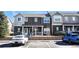Two story brown and beige condo building with parking at 14700 E 104Th Ave # 2605, Commerce City, CO 80022