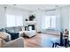 Bright living room with hardwood floors, fireplace and ample natural light at 14700 E 104Th Ave # 2605, Commerce City, CO 80022