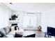 Spacious living room with L-shaped sofa and fireplace at 14700 E 104Th Ave # 2605, Commerce City, CO 80022