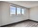 An empty room with modern flooring and a window with views, perfect for customization at 2225 Buchtel Blvd # 1003, Denver, CO 80210