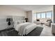 Bright bedroom with stylish furniture, neutral color palette, and comfortable seating area at 2225 Buchtel Blvd # 1003, Denver, CO 80210