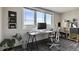Modern office space with sleek desk, comfortable chair, and abundant natural light at 2225 Buchtel Blvd # 1003, Denver, CO 80210
