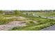 Scenic aerial view of the landscape showcasing grassy areas and roadway at 9481 E Mansfield Ave # 301, Aurora, CO 80014